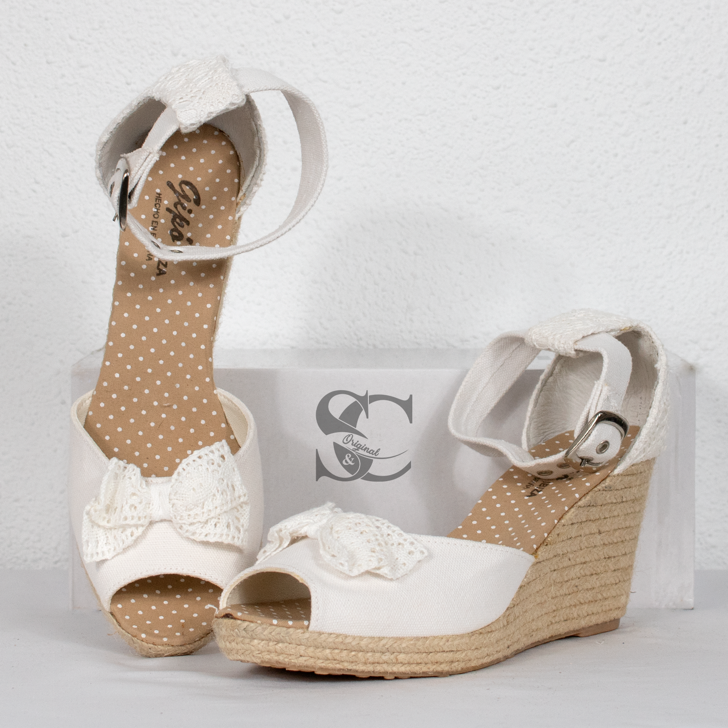 Sandalias de cuña colección Ibiza con detalle lazo