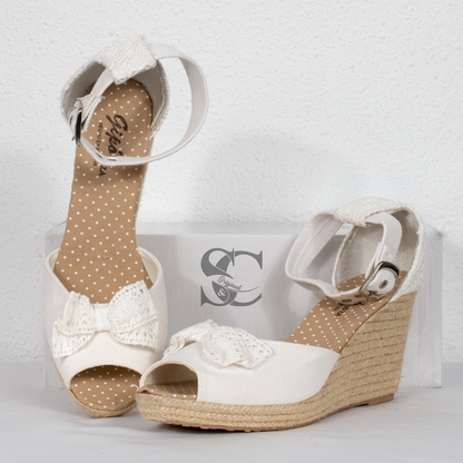 Sandalias de cuña colección Ibiza con detalle lazo